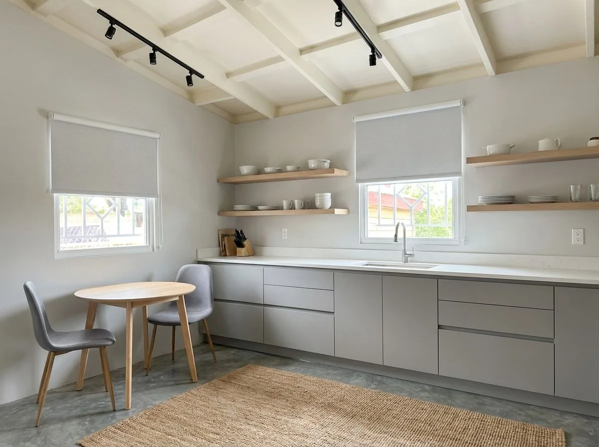 Minimalist modern kitchen with light grey cabinets, white quartz countertop, open wood shelves, jute rug, track lighting, photorealistic interior design photography, 8k